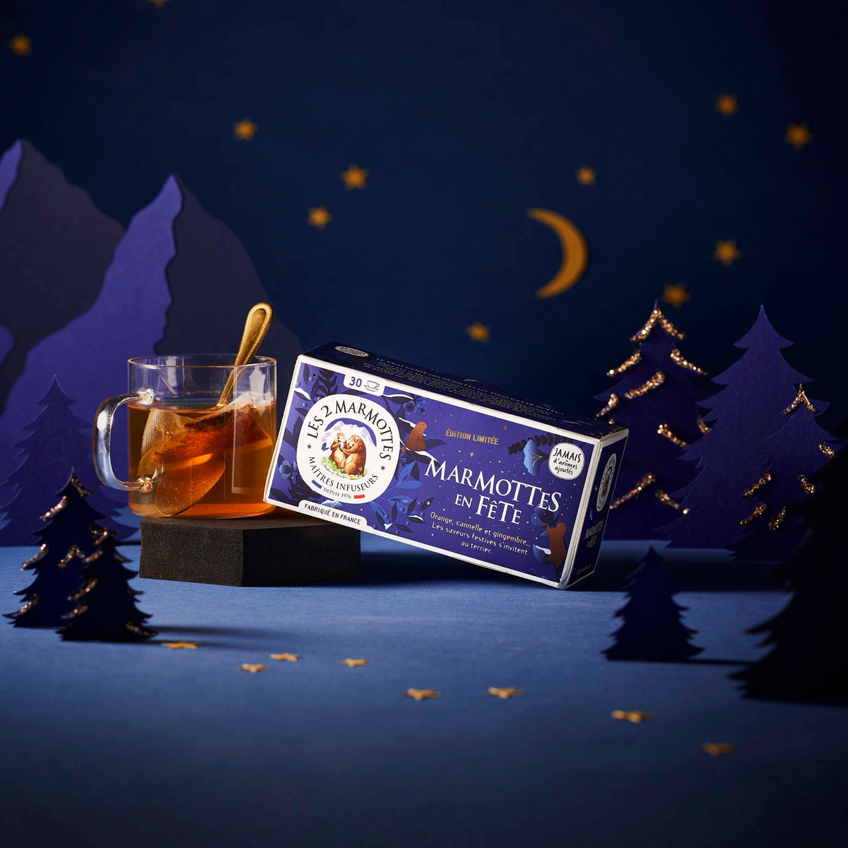 Tisane de Noël Marmottes en Fête : tisane orange, cannelle, gingembre, saveurs authentiques sans arômes ajoutés. Idée cadeau Noel Secret Santa pour fans d'infusions.